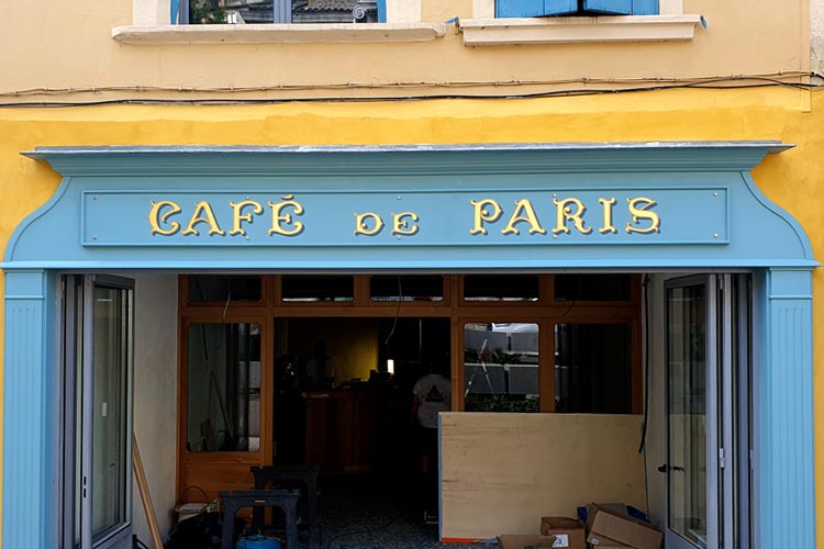 Gold leaf lettering saying cafe de paris by Jill Strong